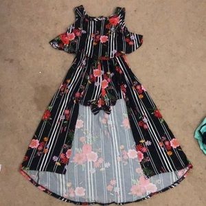 Black dress/ jumpsuit with white stripes and floral pattern.